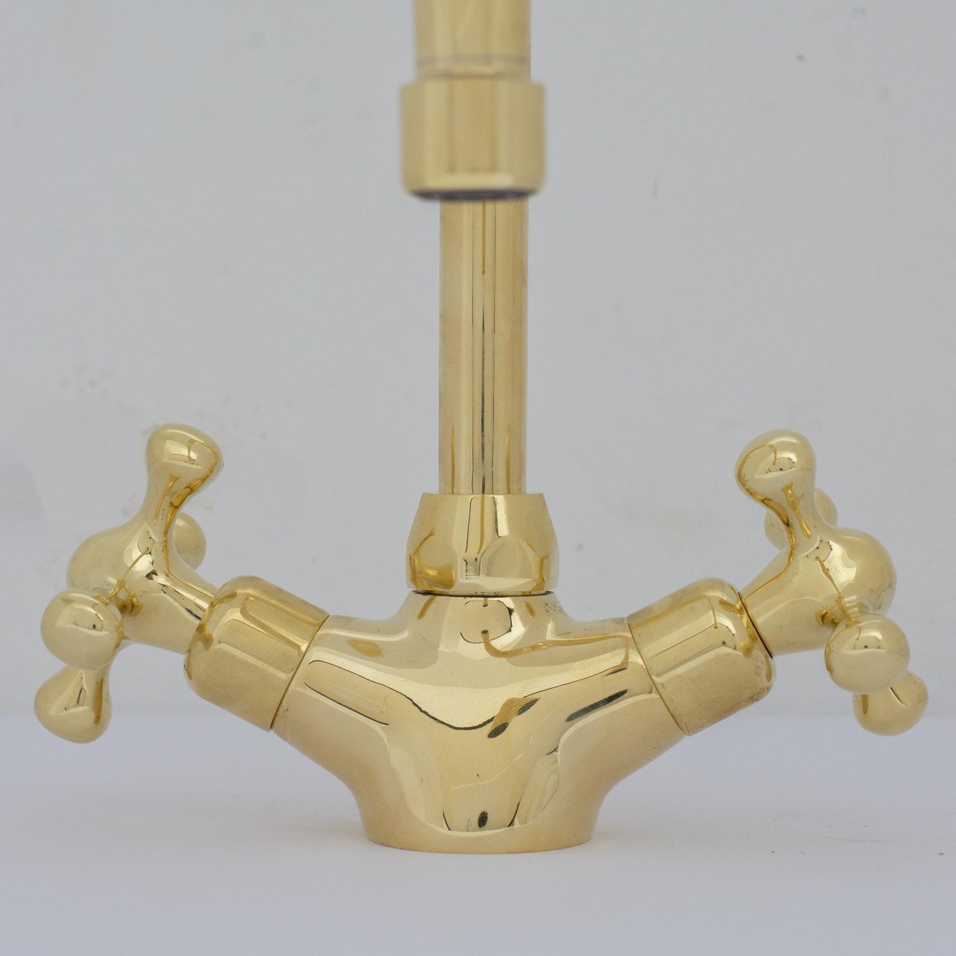 Experience refined craftsmanship and lasting quality with Unlacquered Brass Compact Single Hole Faucet that will develop natural patina over time.