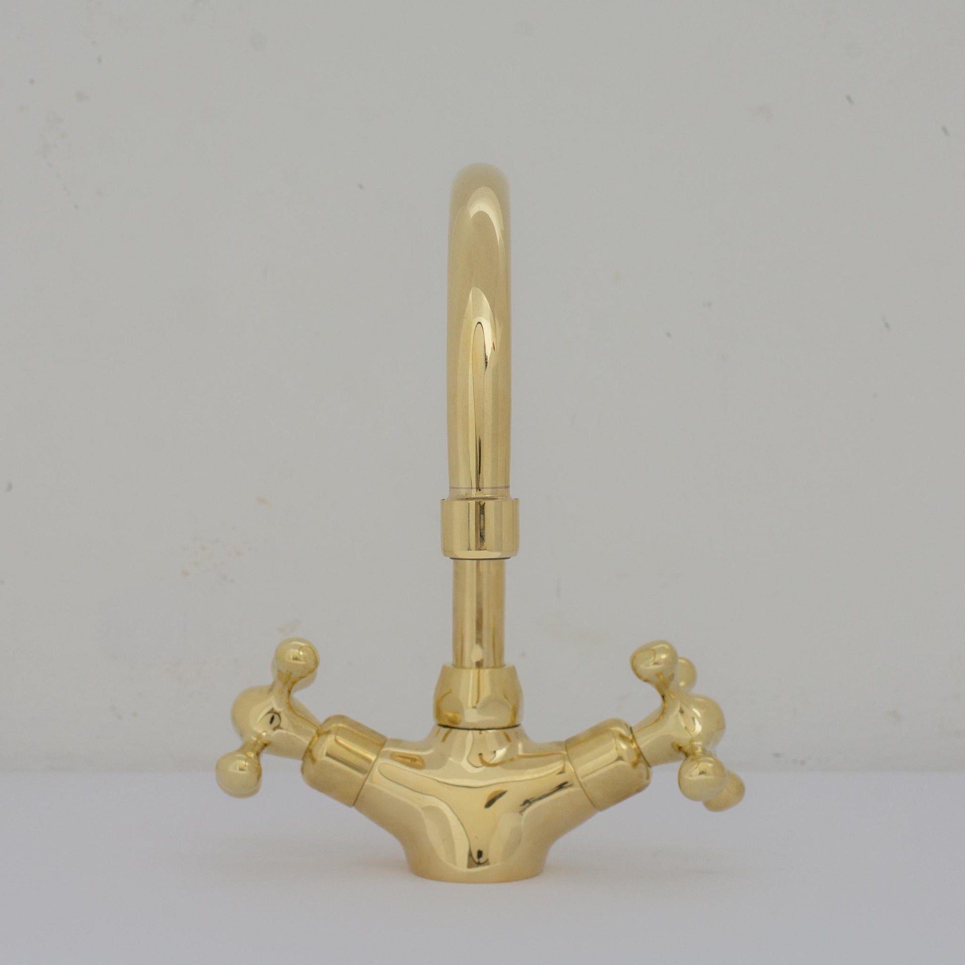 Experience refined craftsmanship and lasting quality with Unlacquered Brass Compact Single Hole Faucet that will develop natural patina over time.