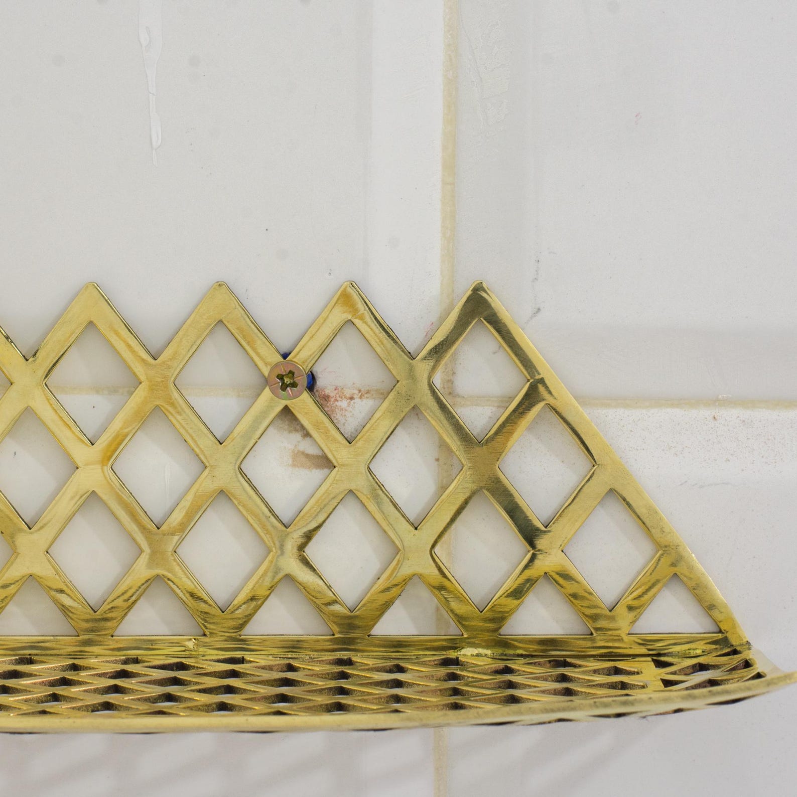 Experience authentic craftsmanship With Insideast Solid Brass Double Grid Corner Shelf that will develop natural patina with time.