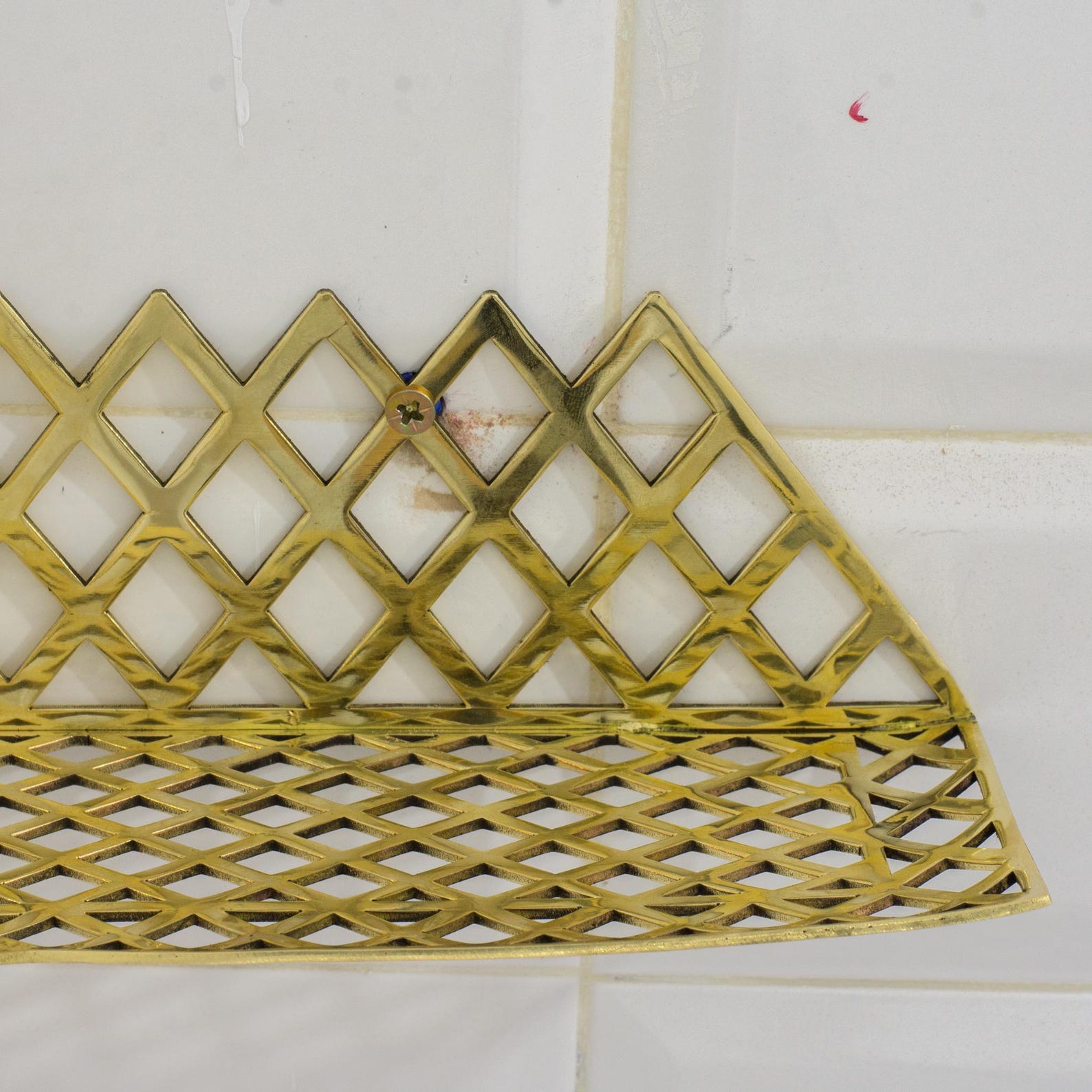 Experience authentic craftsmanship With Insideast Solid Brass Double Grid Corner Shelf that will develop natural patina with time.