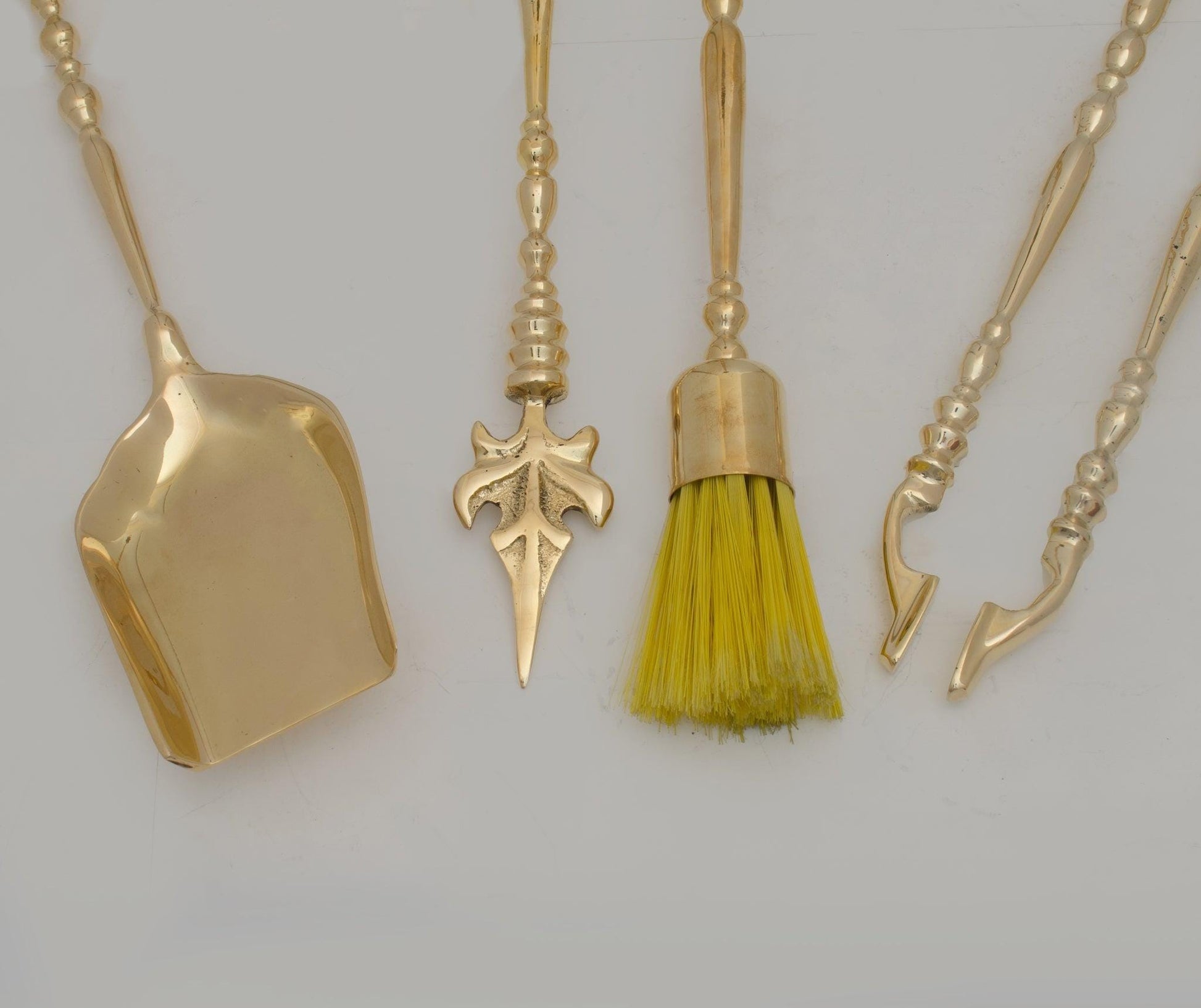 Experience refined authenticity with our Handmade Solid Brass Fireplace Tools Set that will develop natural, warm patina over time.