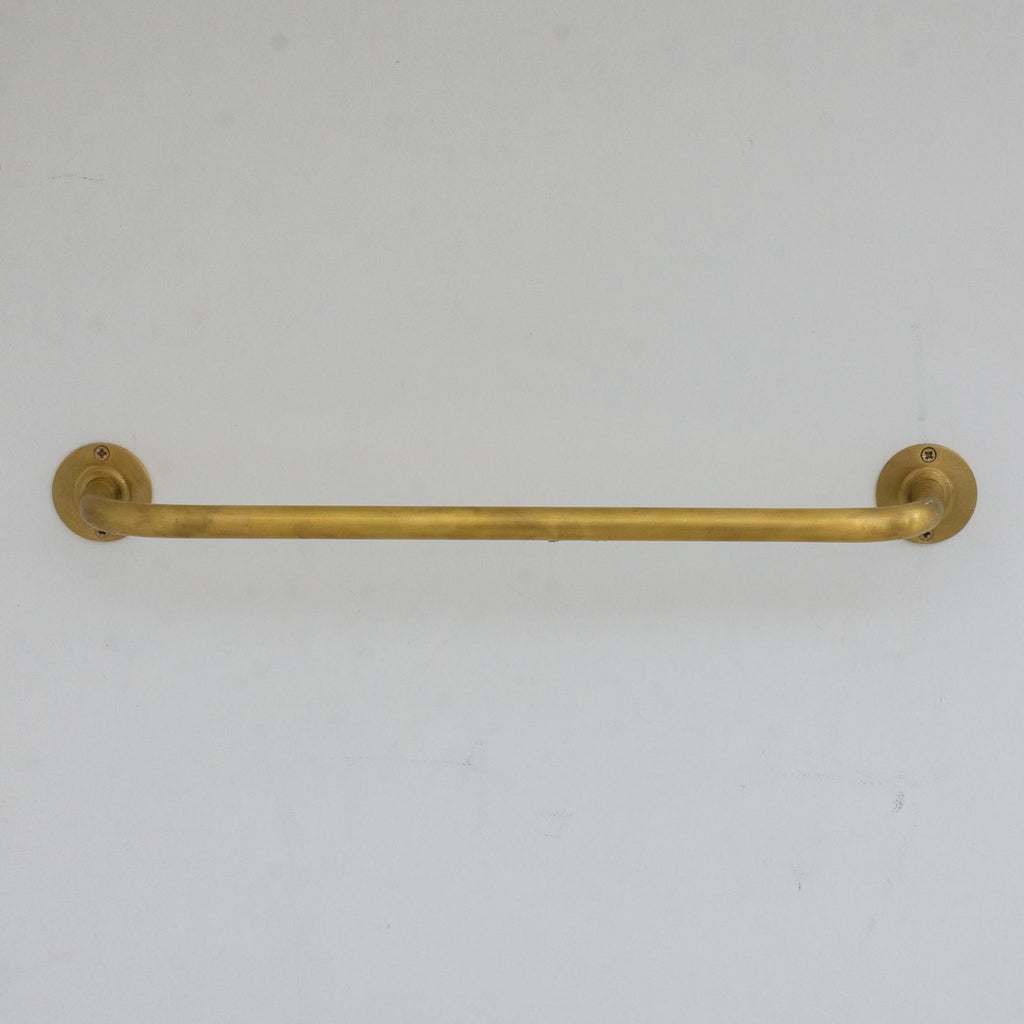 Experience authentic craftsmanship With Insideast Unlacquered Brass Towel Bar Holder that develops warm patina over time.