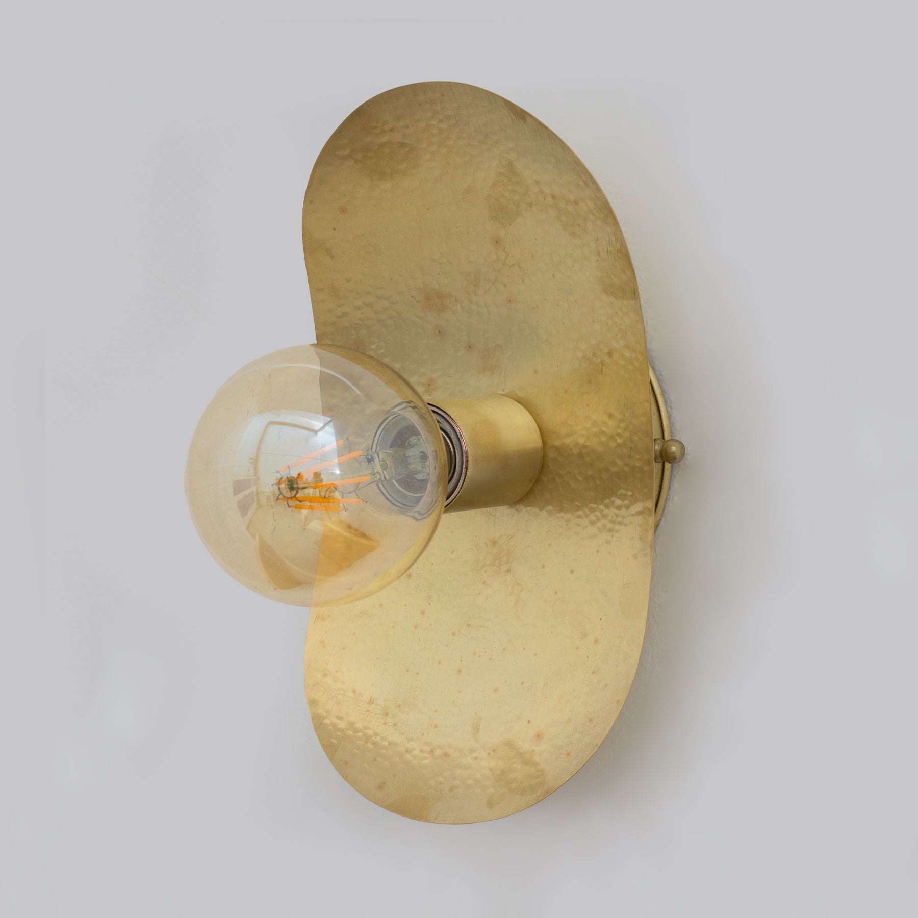 Smooth Hammered Brass Sconce in Use