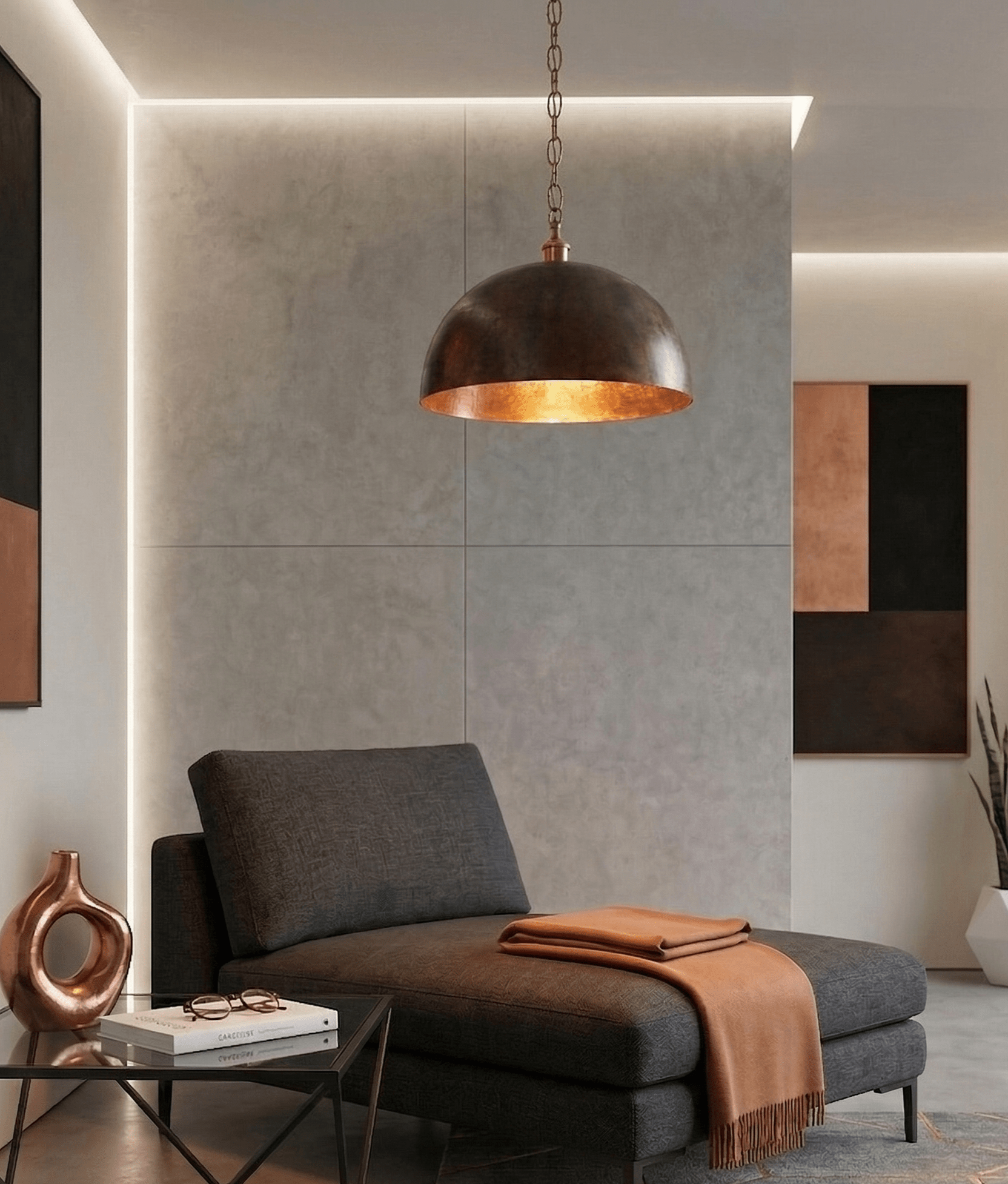 Large rustic copper pendant light with aged dome installed in a cozy reading corner