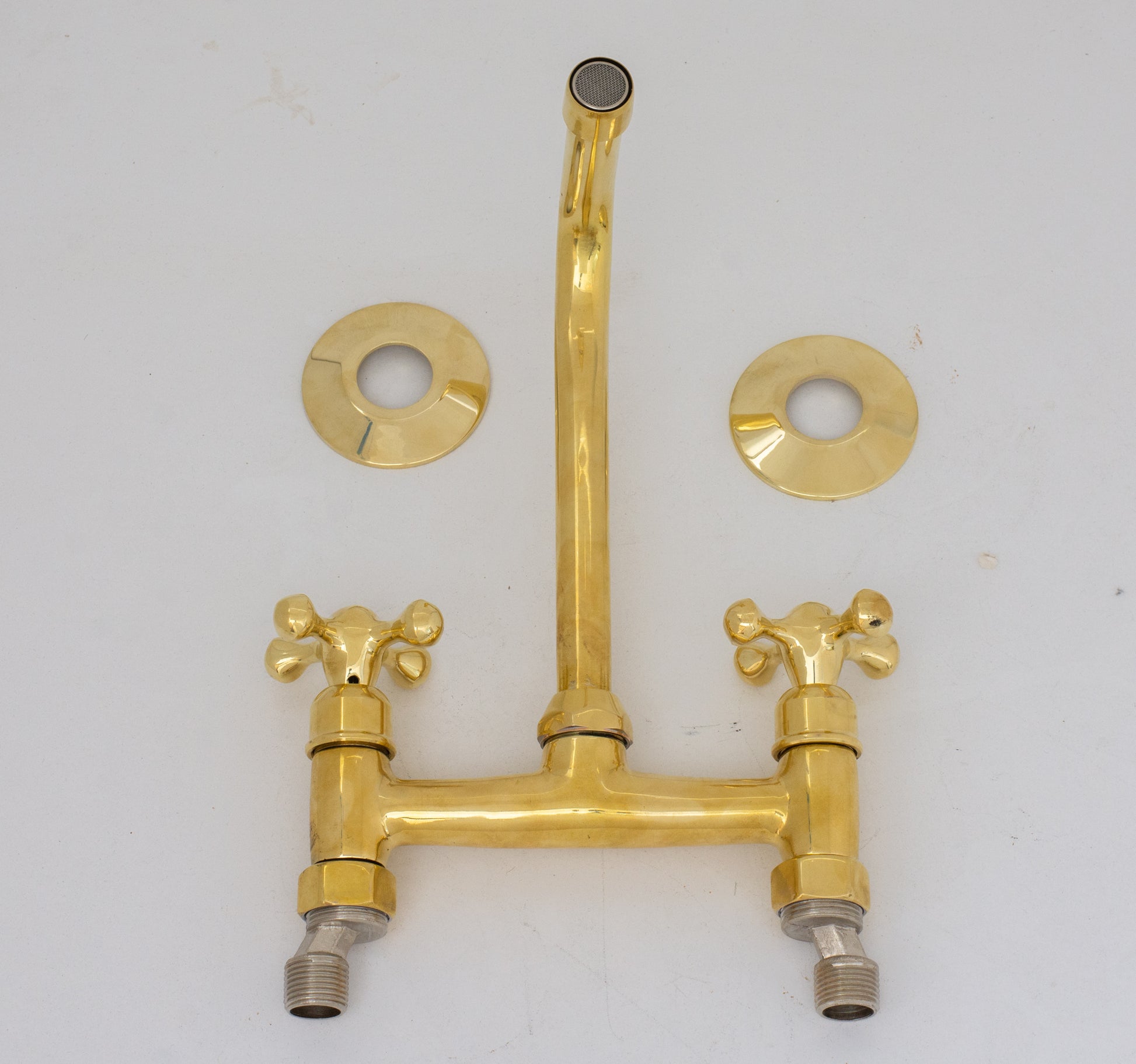 Experience authentic craftsmanship With Insideast Wall-Mounted Bridge Faucet. Built from solid brass and finished in unlacquered brass that develops warm patina over time.