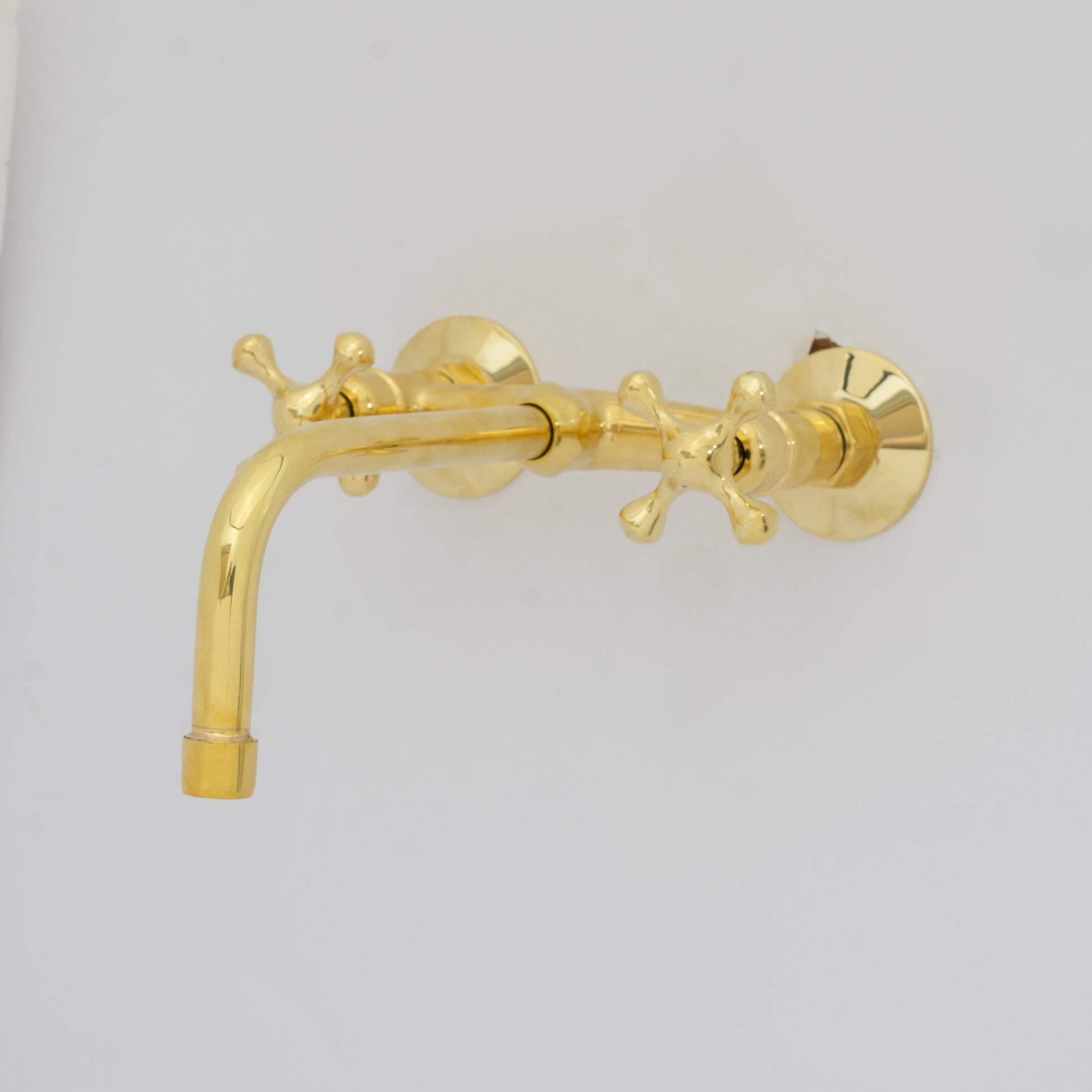 Experience authentic craftsmanship With Insideast Wall-Mounted Bridge Faucet. Built from solid brass and finished in unlacquered brass that develops warm patina over time.