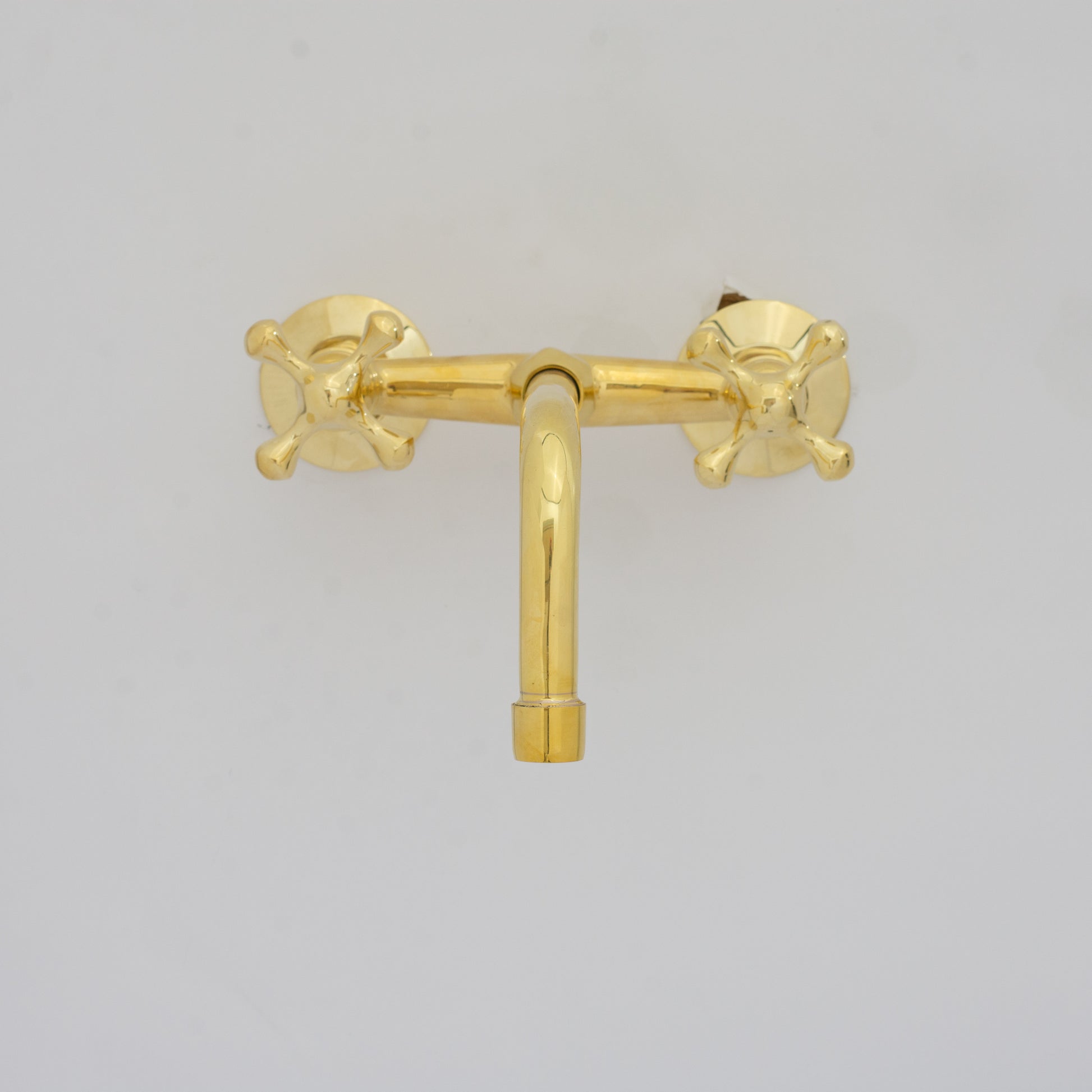 Experience authentic craftsmanship With Insideast Wall-Mounted Bridge Faucet. Built from solid brass and finished in unlacquered brass that develops warm patina over time.