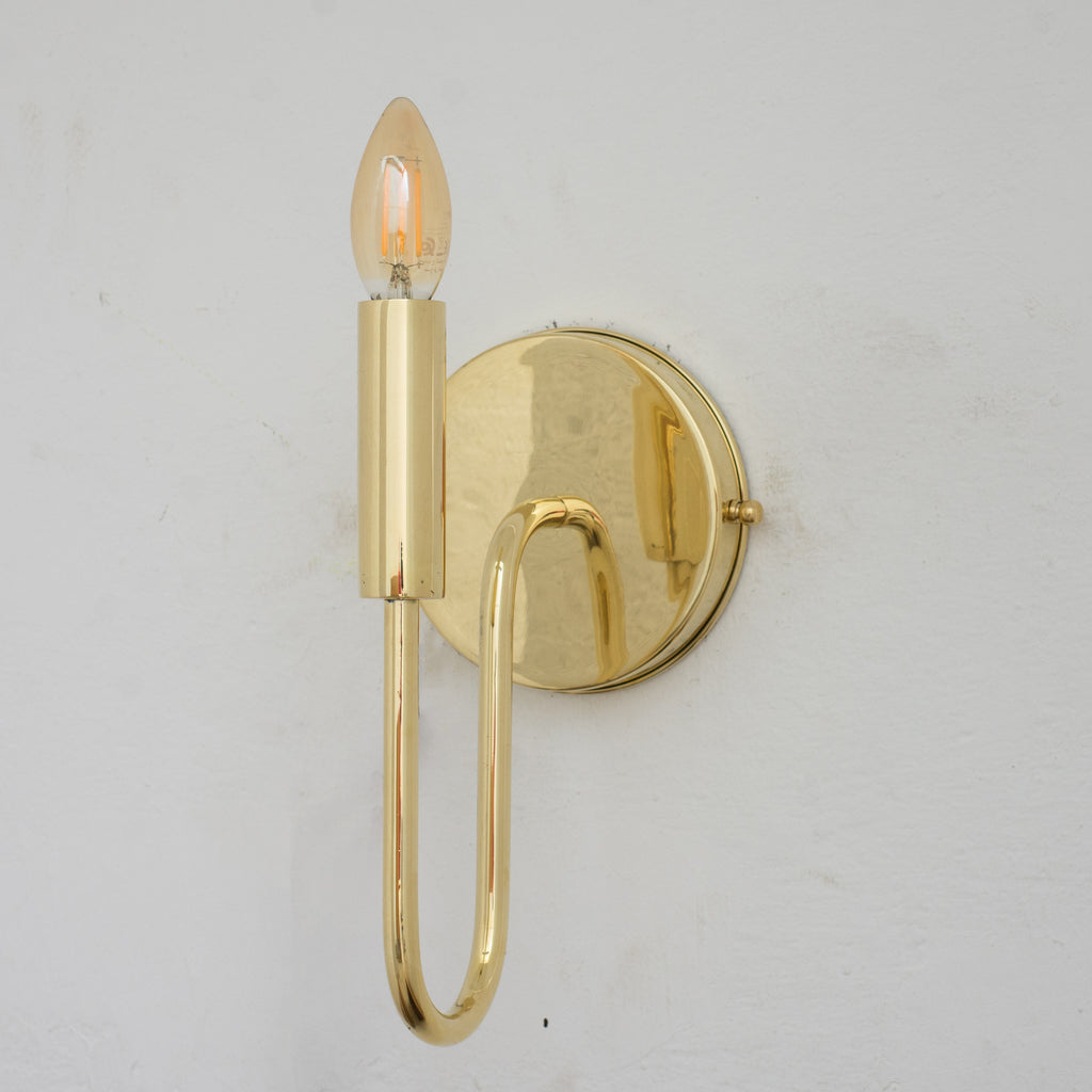 Experience authentic craftsmanship With our Unlacquered Brass Arch Sconce Light that will develops natural patina with time. 