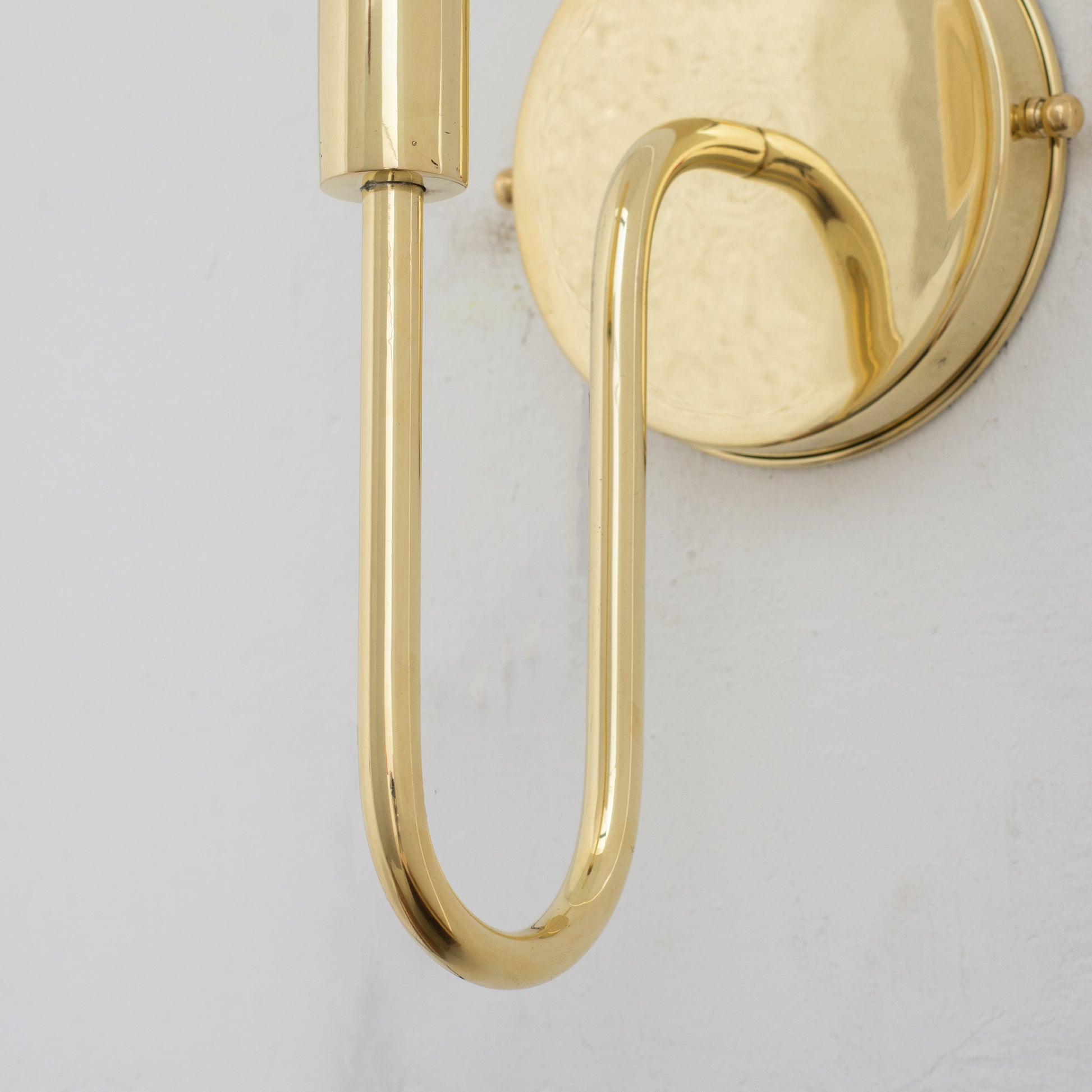 Experience authentic craftsmanship With our Unlacquered Brass Arch Sconce Light that will develops natural patina with time.