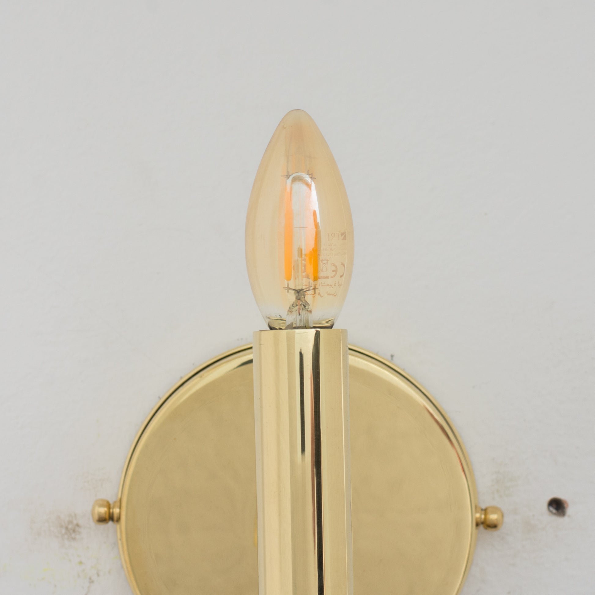 Experience authentic craftsmanship With our Unlacquered Brass Arch Sconce Light that will develops natural patina with time.