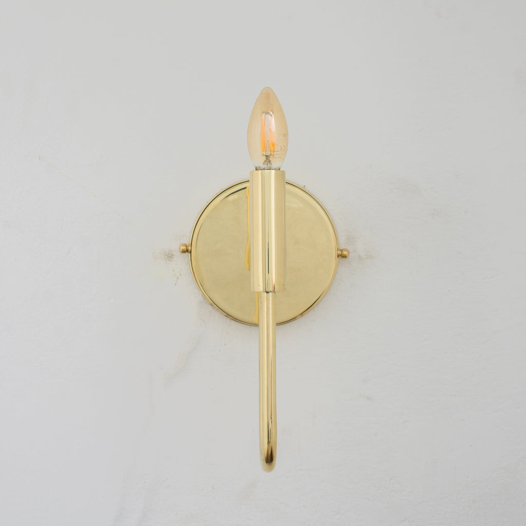 Experience authentic craftsmanship With our Unlacquered Brass Arch Sconce Light that will develops natural patina with time.