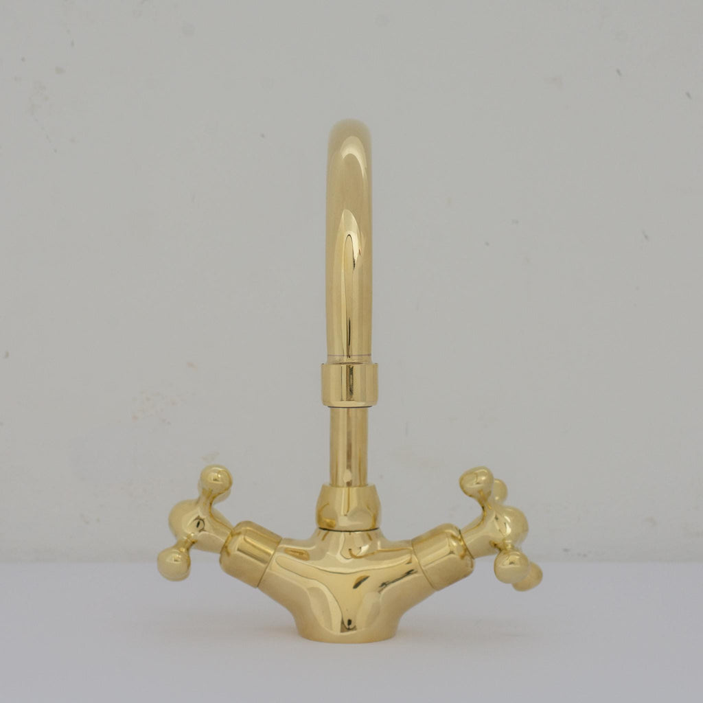 Experience refined craftsmanship and lasting quality with Unlacquered Brass Compact Single Hole Faucet that will develop natural patina over time.