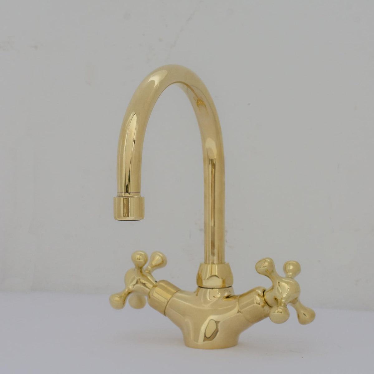 Experience refined craftsmanship and lasting quality with Unlacquered Brass Compact Single Hole Faucet that will develop natural patina over time.