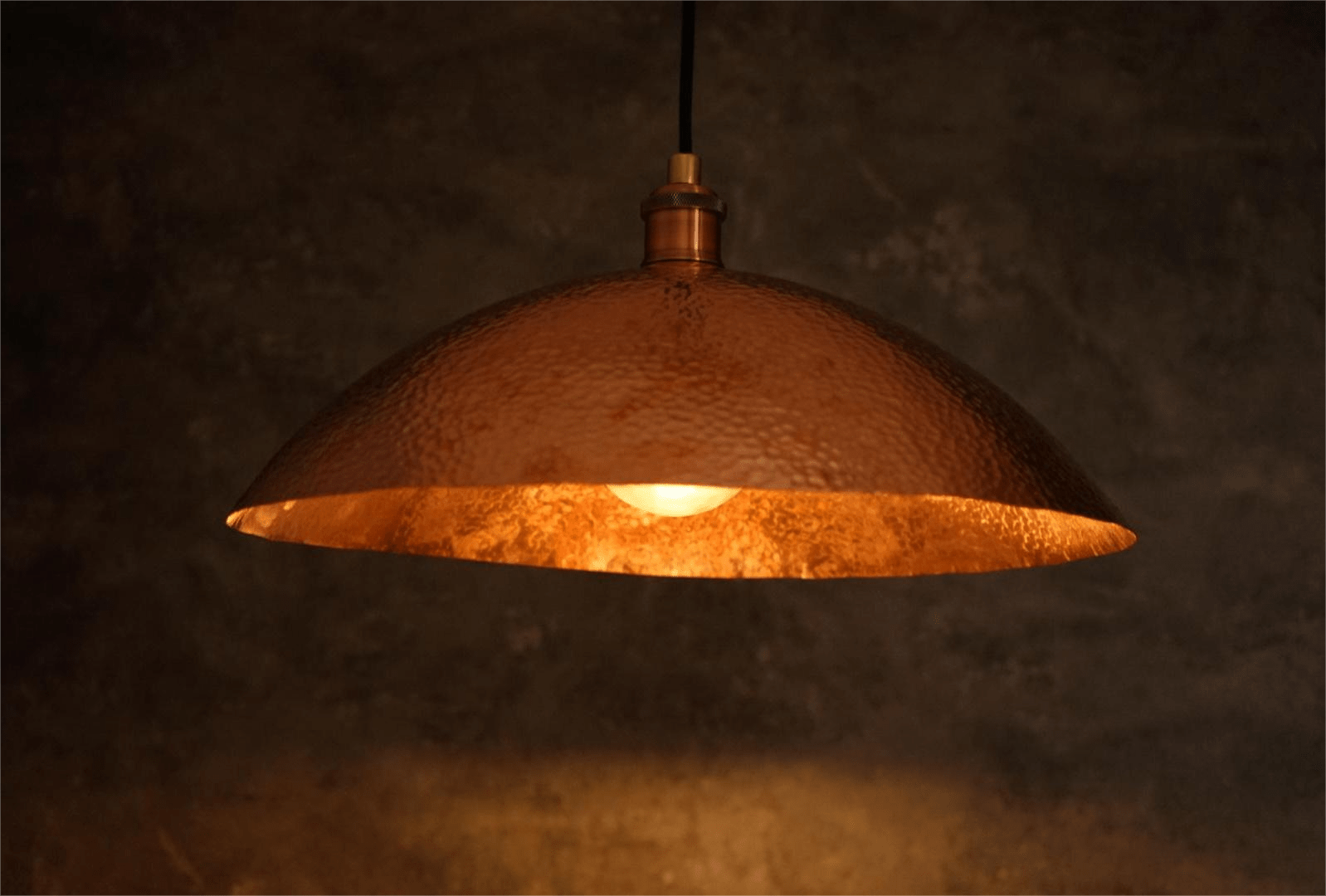 Hammered solid copper dome pendant light with visible artisan hammer marks