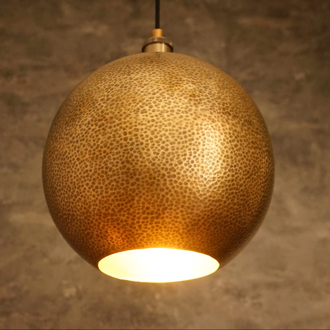 Hammered brass ball pendant light, warm gold dome, natural unlacquered finish, Insideast