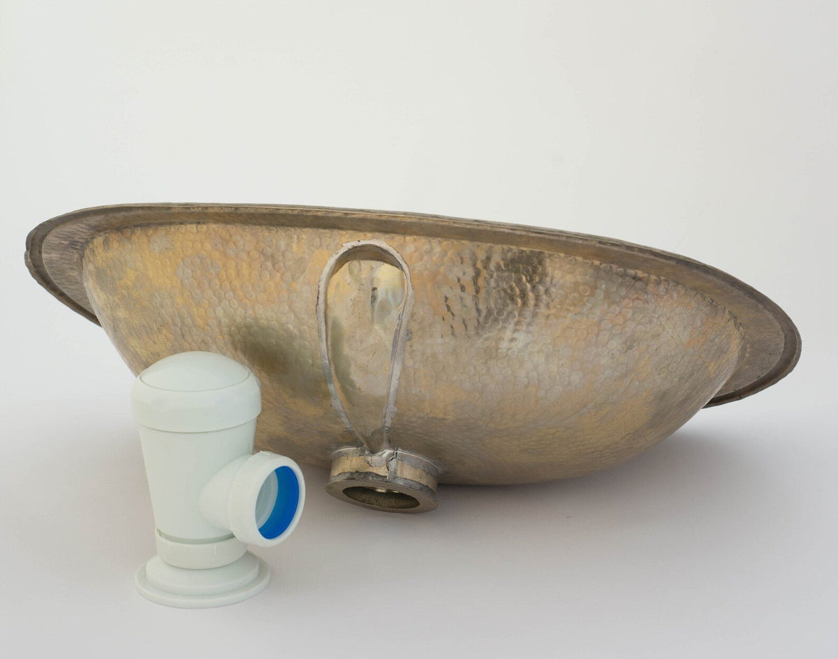 Drop-in antique brass oval bathroom sink with matching brass drain