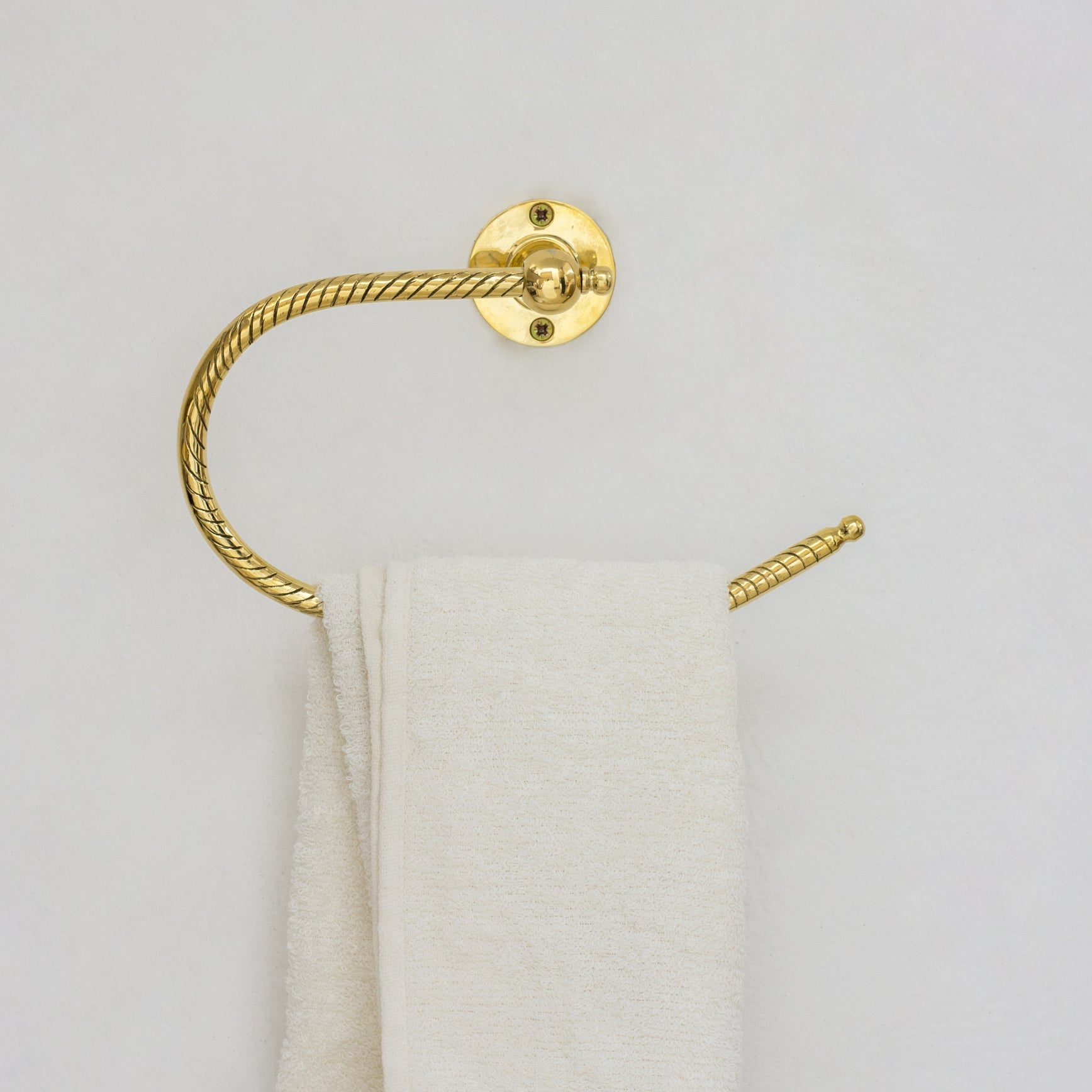 Unlacquered brass towel holder, hand engraved finish