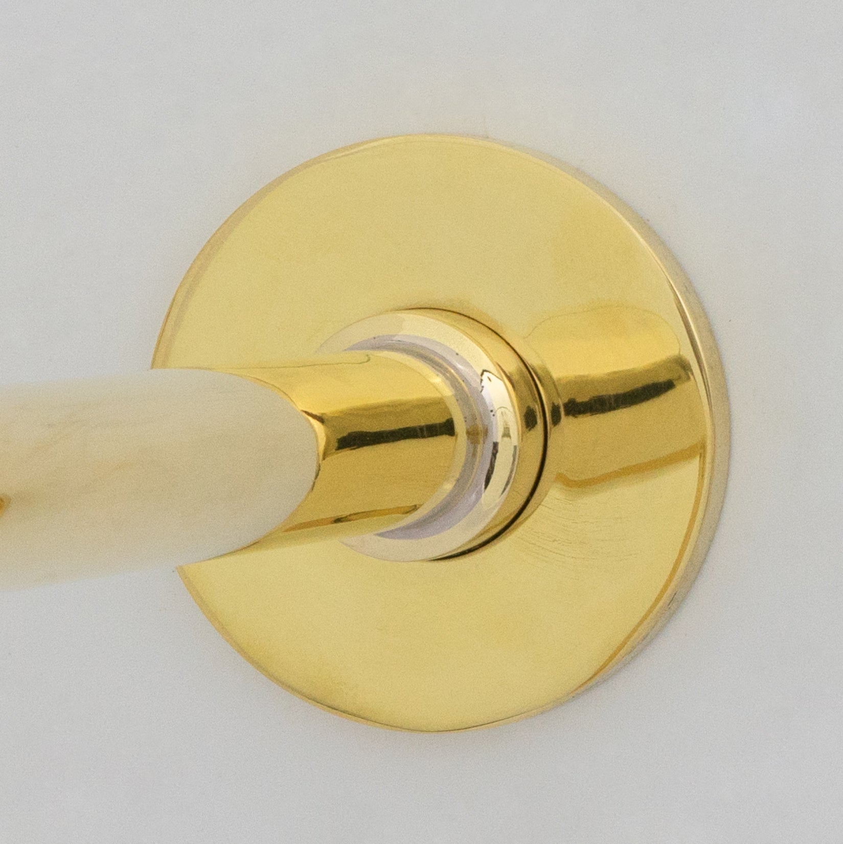 Unlacquered brass vessel sink faucet handle detail
