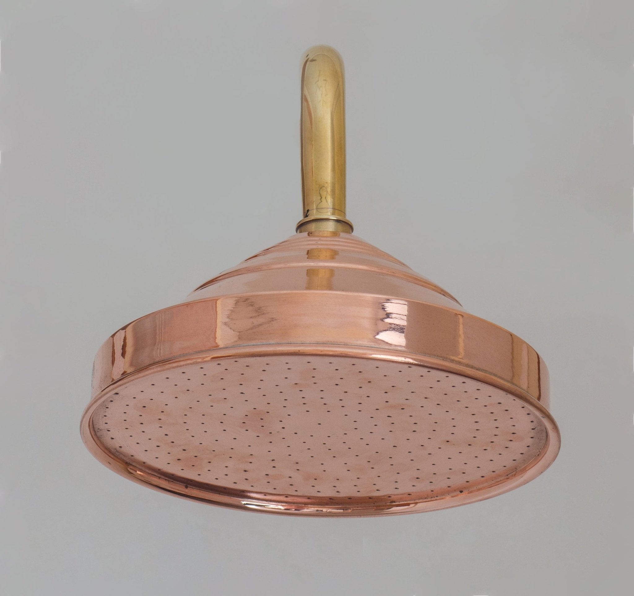 Tapered conical rain shower head, solid metal body detail